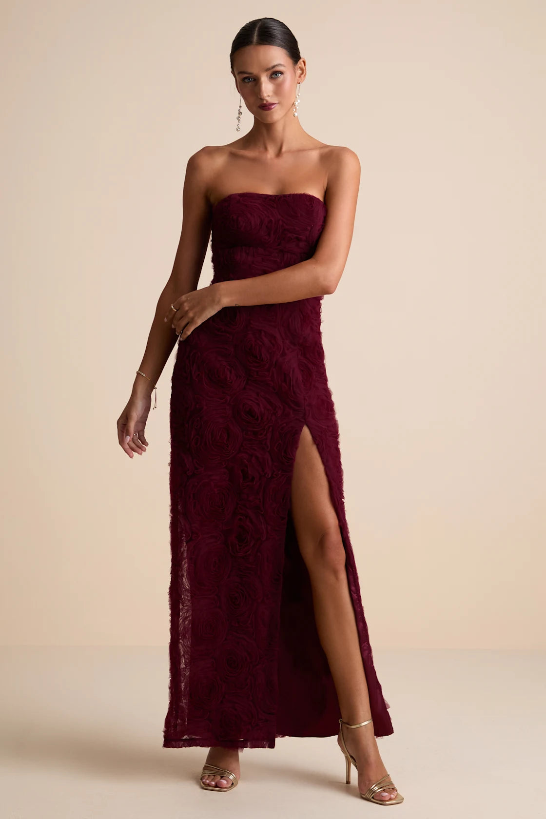 You'll instantly become the definition of romance when you step into this sleek satin dress, featuring a slip-style silhouette that gracefully skims the figure. The midi design features wide pleated straps that support a plunging bodice with lightly